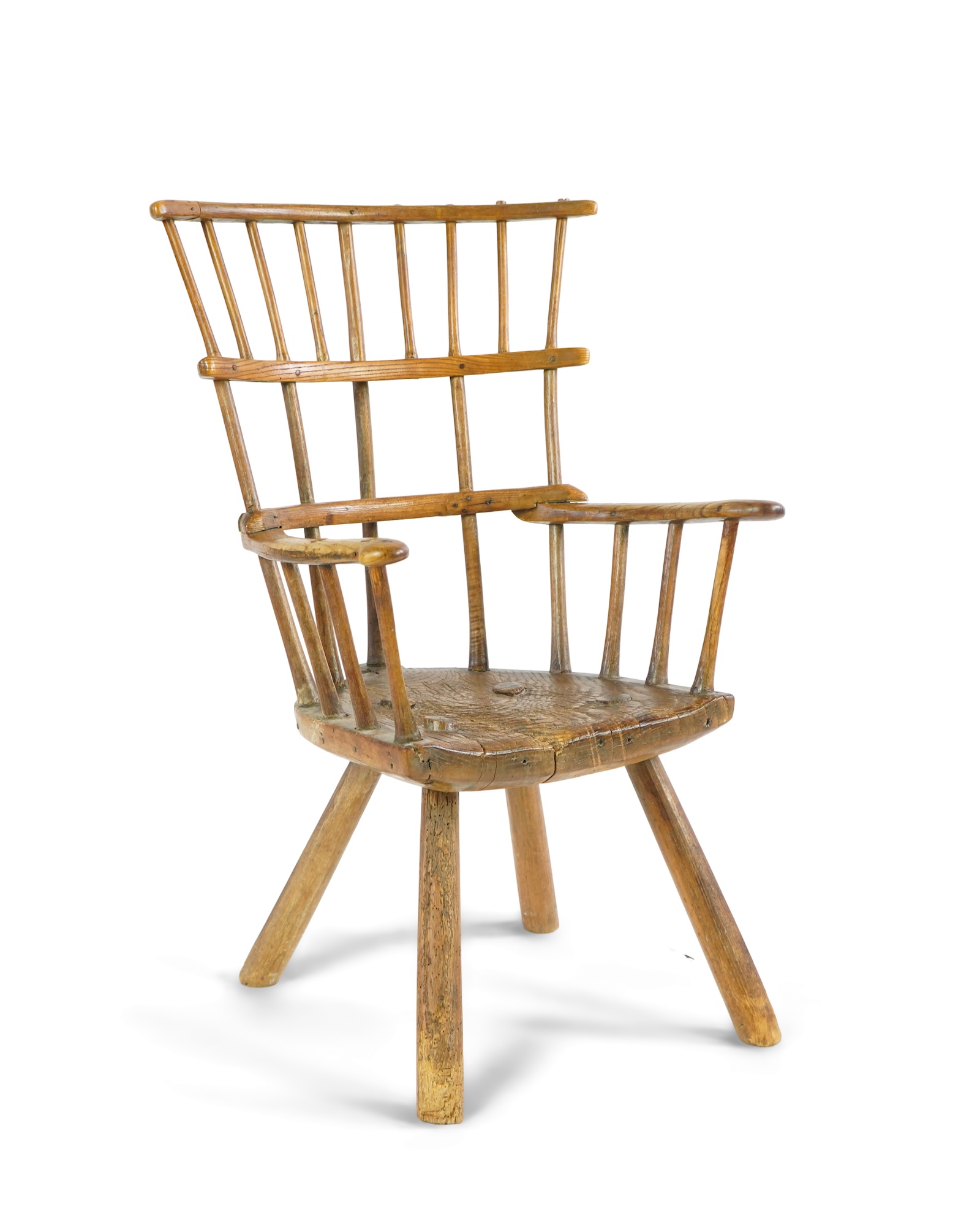 An 18th or 19th century primitive ash and elm Windsor armchair
